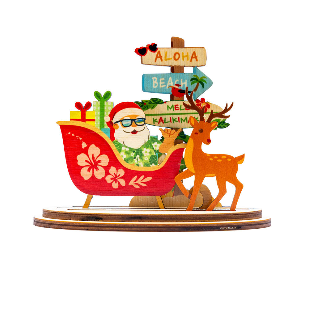 Decorative Christmas scene with Santa Claus, reindeer, and tropical elements on a white background