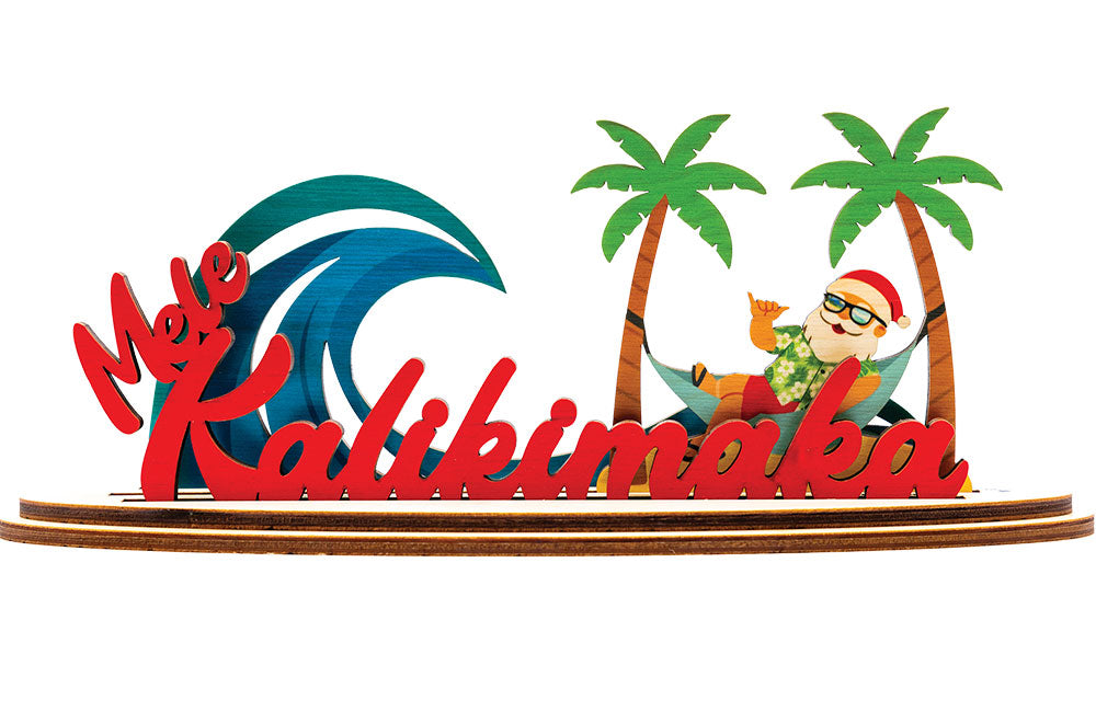 Decorative 3D holiday sign with 'Mele Kalikimaka' script, Santa Claus in a hammock, a blue wave and palm trees on a white background