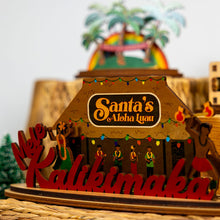 Load image into Gallery viewer, Wooden decorative sign with &#39;Santa&#39;s Aloha Luau&#39; and &#39;Kalikimaka&#39; text, surrounded by festive decorations.
