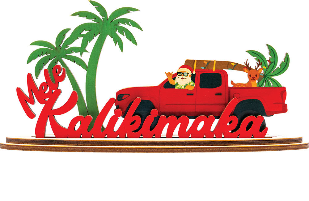 Decorative sign with a red truck, Santa Claus, and palm trees featuring 'Mele Kalikimaka' text.
