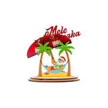 Load image into Gallery viewer, Decorative figurine with Santa Claus in a hammock under palm trees and a red roof, with &#39;Mele Kalikimaka&#39; text.
