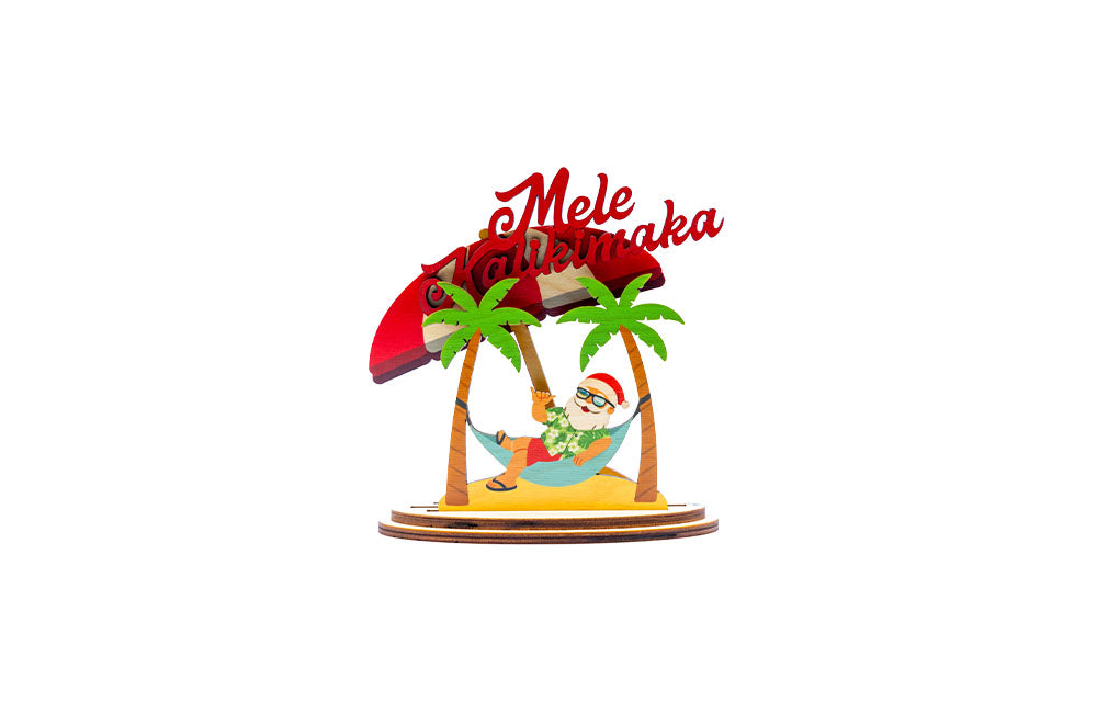 Decorative figurine with Santa Claus in a hammock under palm trees and a red roof, with 'Mele Kalikimaka' text.
