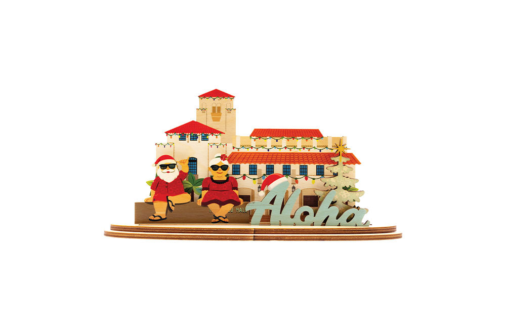 3D sign of Honolulu Hale building with Shaka Santa and Mrs Clause characters and 'Aloha' sign on a white background