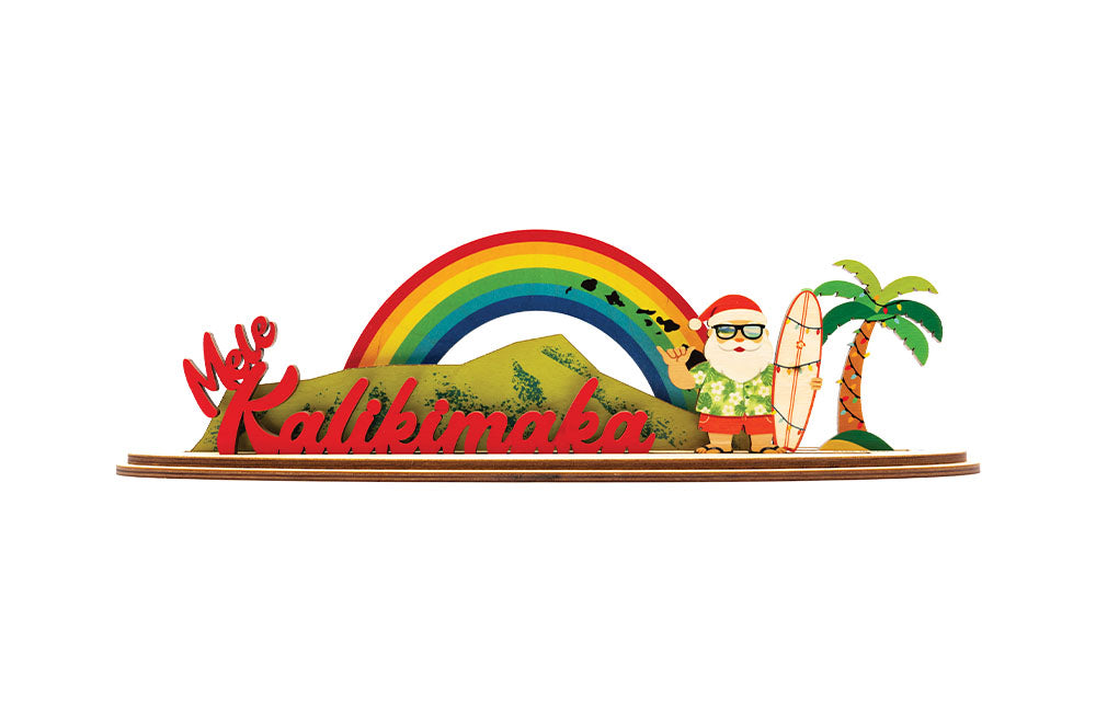 Decorative sign with a rainbow, palm tree, Diamond Head and tropical Santa Claus figure with 'Mele Kalikimaka' text.
