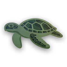 Load image into Gallery viewer, Green turtle-shaped double layered wall decor on a white background
