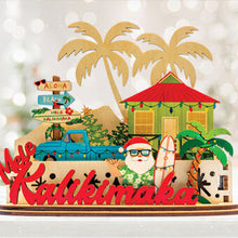 Load image into Gallery viewer, Decorative 3D holiday tiered sign with Santa holding a surfboard, a blue truck, beach shack and other tropical elements with &#39;Mele Kalikimaka&#39; script in front of white lights background
