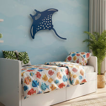 Load image into Gallery viewer, Children's bedroom with a bed featuring fish-patterned bedding, a blue stingray wall decoration, and a plant.
