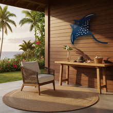 Load image into Gallery viewer, Outdoor patio with wooden chair, table, and decorative manta ray cutout against a wooden wall.
