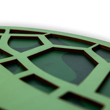Load image into Gallery viewer, Close-up of a green decorative wood turtle cutout with geometric cut-out patterns on a white background
