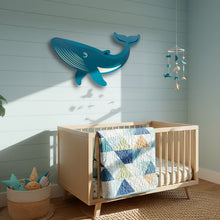 Load image into Gallery viewer, Children's room with wooden crib, whale wall decoration, and colorful bedding.
