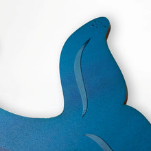 Load image into Gallery viewer, Close up detail of blue whale tail wood wall decor on a white background

